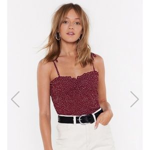 Red touched tank top with white polka dots